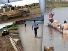 Mit Erde verschmutzer Jeep, überschwemmtes Land, zwei Männer in beladenem Kanu. Hochwasser hat Regionen im Südsudan überflutet.